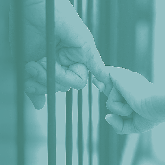 Youngster's hand holding an adult's finger